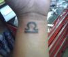 zodiac libra tattoo on wrist