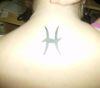 pisces sign pic tattoo on back