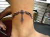 tribal sagittarius tattoo on leg