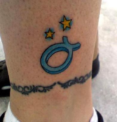Taurus Sign And Yellow Star Tattoo On Leg
