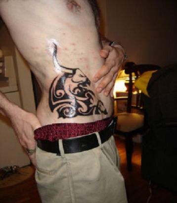 Tribal Taurus Tattoo On Side Stomach
