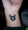 taurus sign tattoo on wrist