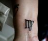symbol virgo tattoos on wrist