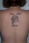 angel baby tats on girl's back