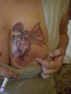 fairy tattoo with flower