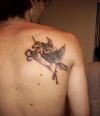 flying unicorn tattoo on right shoulder