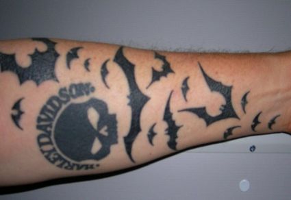 Bat And Skull Tattoo On Arm