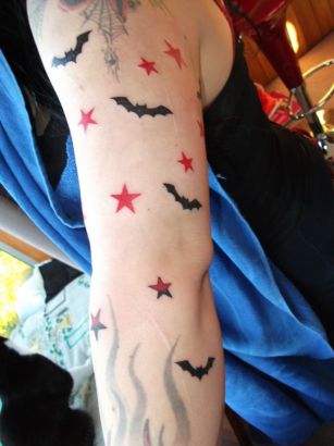 Bat And Star Tattoo On Arm