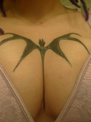 Bat Tattoo On Breast