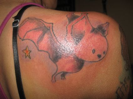 Cartoon Bat Tattoos On Right Shoulder Blade