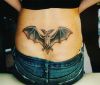 flying bat tattoo on girl's back