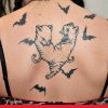 bat tattoo with cat