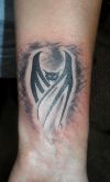 bat image tattoo on arm