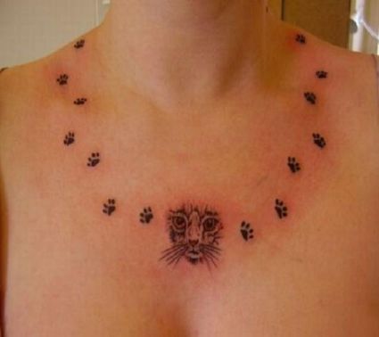 Cat Head And Paw Tattoo On Neck