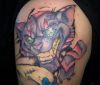 cheshire cat tattoo on arm