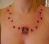 cat head and paw tattoo on neck