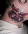 cat head neck tattoo