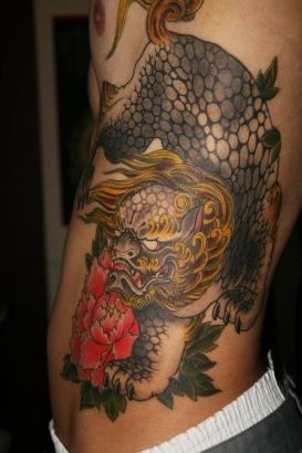 Foo Dog Tattoo On Rib