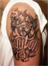 dog head tattoo on left arm