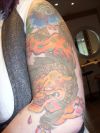 foo dog tattoo on arm