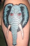 elephant head tattoo on left arm