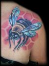 bee image tattoo on right shoulder