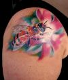flower and bee tattoo on shoulder