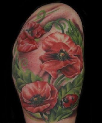 Flower And Ladybug Arm Tattoo