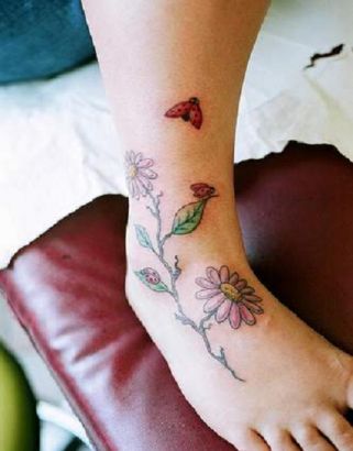 Ladybug And Flower Tattoos On Leg