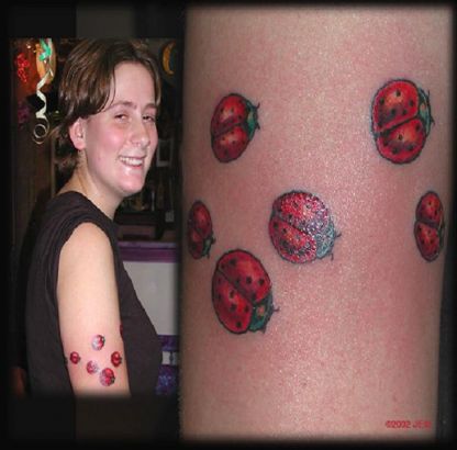 Ladybug Tattoo On Arm Of Women