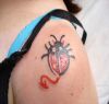 ladybug tattoo on left shoulder