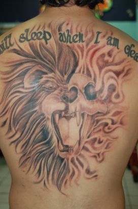 Large Lion And Text Tattoo