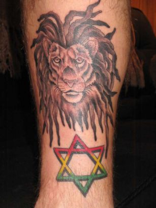 Lion Head And Star Tattoo