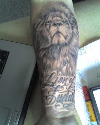 Lion Head And Text Tattoos