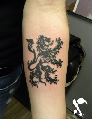 Tribal Lion Picture Tattoo On Arm