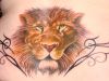 lion head tribal tattoo on back
