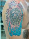 flaming lion tattoo on arm