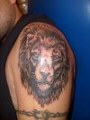 lion head and armband tattoo