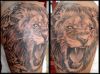 lion head arms tattoo