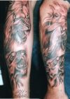 lion heads tattoo on arm