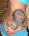 lion tattoo on upper hip