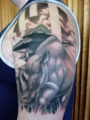 Rhino Tattoo On Left Arm