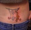 monkey tattoo on lower back