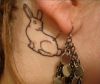 rabbit tattoo on back of ear