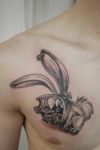 cartoon rabbit tattoo on chest