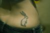 rabbit tattoo on upper hip