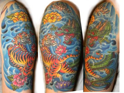 Tiger And Dragon Fights Tattoo