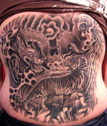 Tiger And Dragon Fights Tattoo