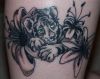tiger cub and flower tattoo