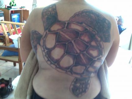 Turtle Tattoo On Woman's Back